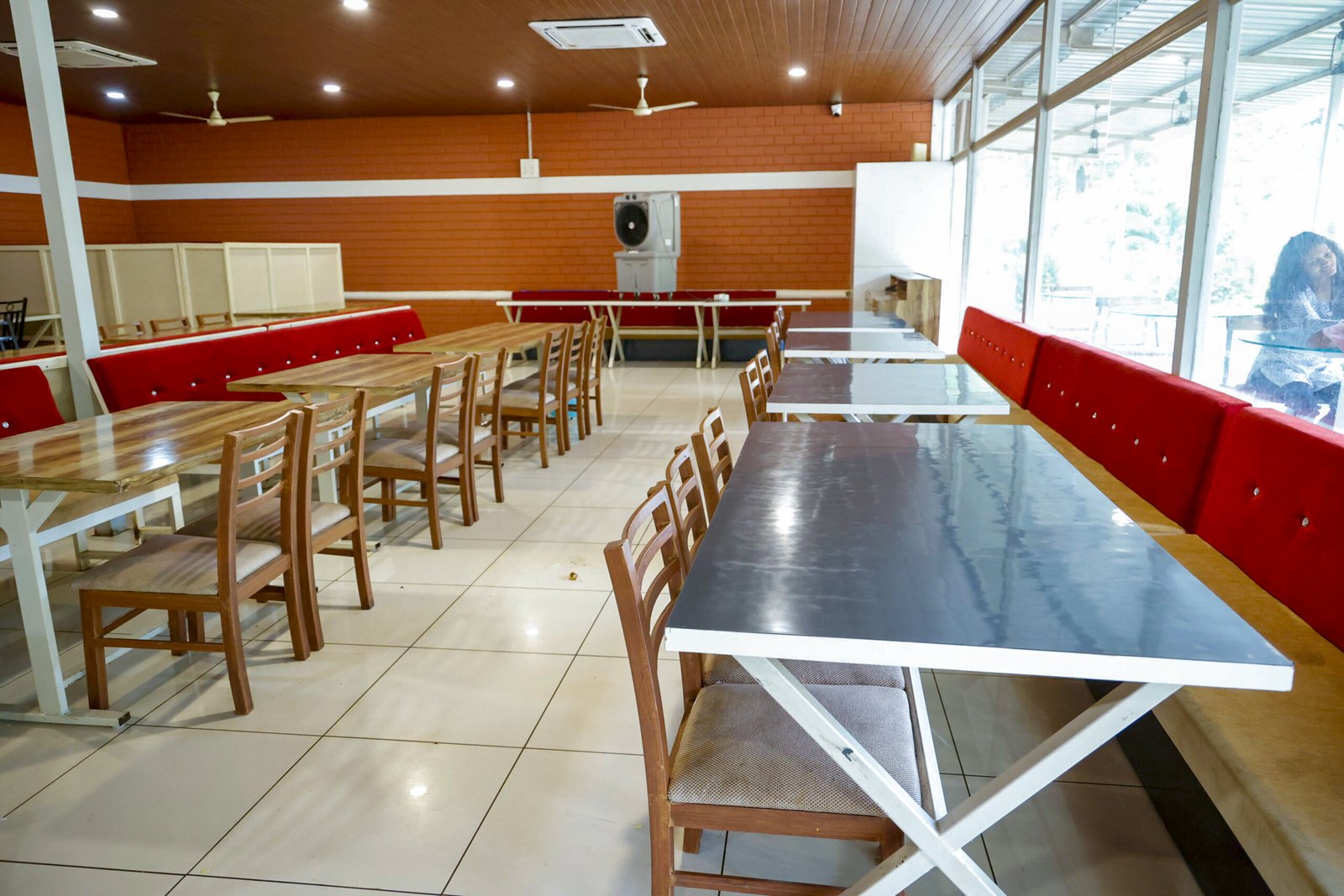 Peaceful outdoor dining atmosphere surrounded by greenery at Dandeli resort