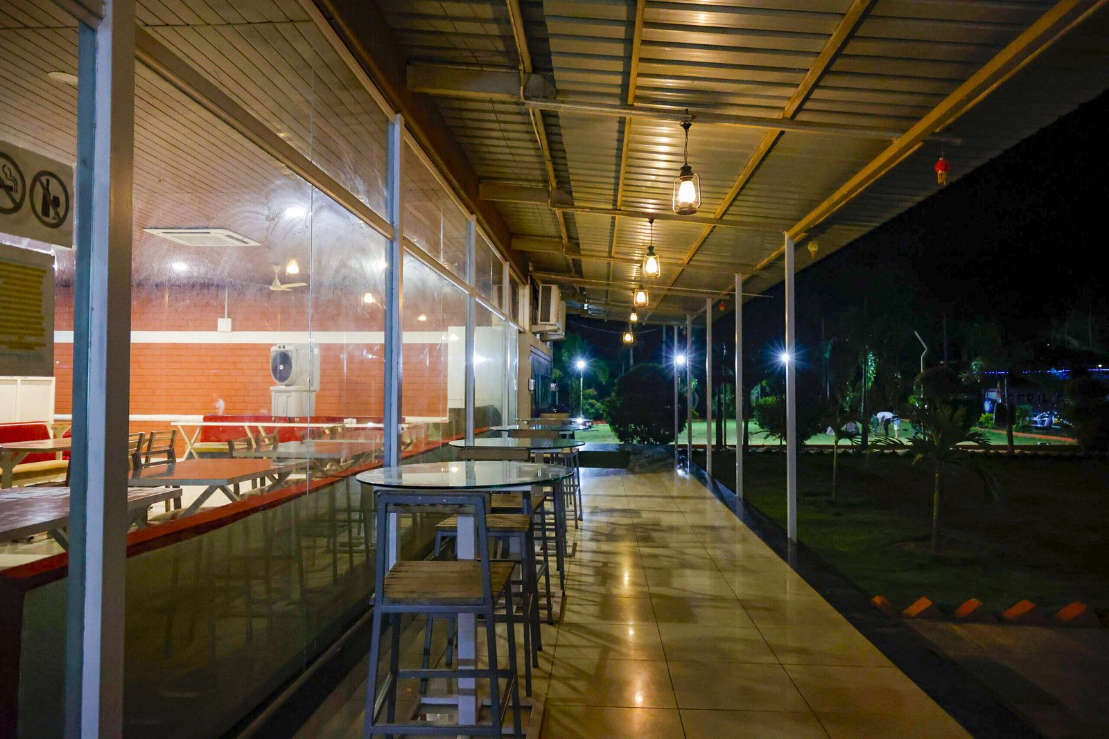 Comfortable restaurant seating area at a riverside resort in Dandeli Karnataka